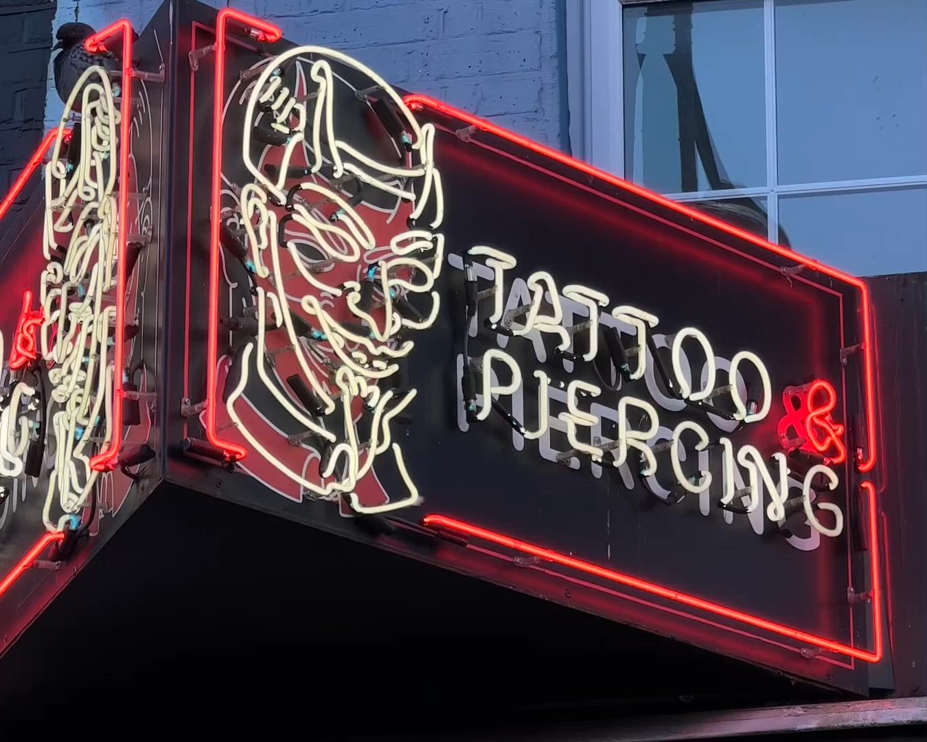 The original Boys Don't Cry neon tattoo and piercing sign in Camden