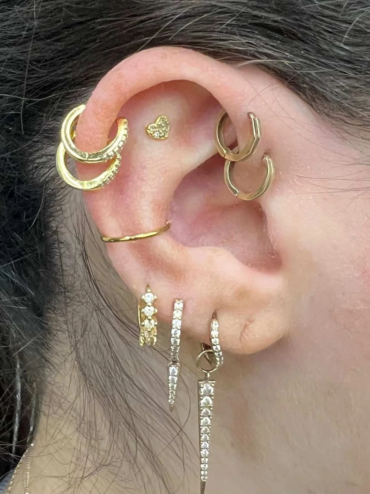 Curated ear piercing with gold jewellery
